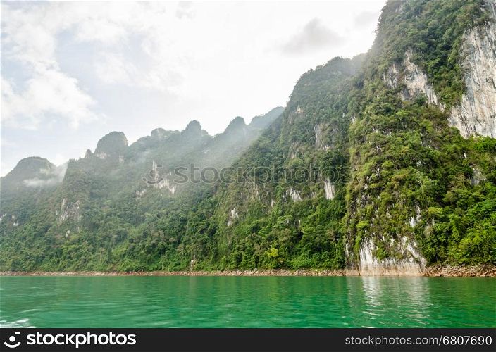 Beautiful high mountains and river in the morning at Ratchaprapha Dam, Khao Sok National Park, Surat Thani Province, Thailand&#xA;