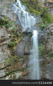 Beautiful high tibetan waterfall in the mountains