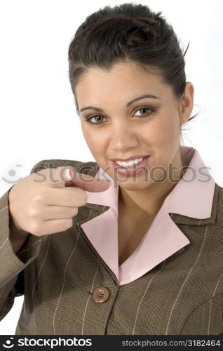 Beautiful Hispanic business woman pointing towards camera.