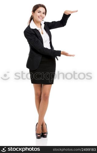 Beautiful hispanic business woman smiling over a white background and showing something