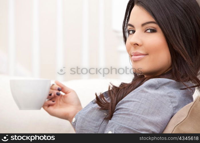 Beautiful Hispanic Latina Woman Drinking Tea or Coffee