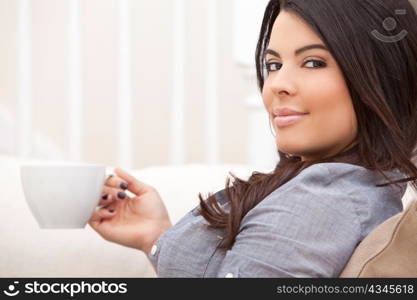 Beautiful Hispanic Latina Woman Drinking Tea or Coffee