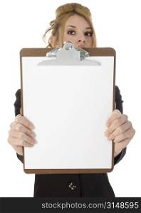 Beautiful Hispanic woman holding out blank clipboard. Shot in studio over white.