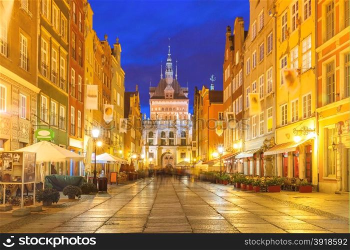 Beautiful historic houses and Golden Gate on Long Lane in Gdansk Old Town at night, Poland