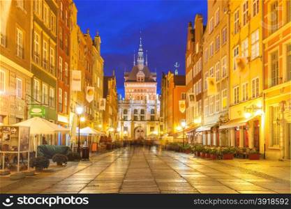 Beautiful historic houses and Golden Gate on Long Lane in Gdansk Old Town at night, Poland