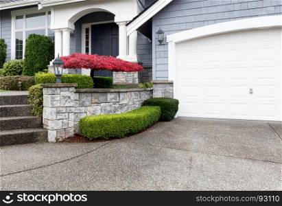 Beautiful home exterior with Autumn color maple tree