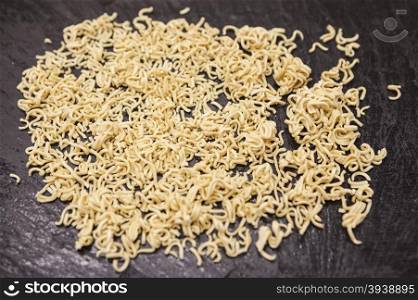 Beautiful homemade Italian pasta from durum wheat on stone background, closeup.