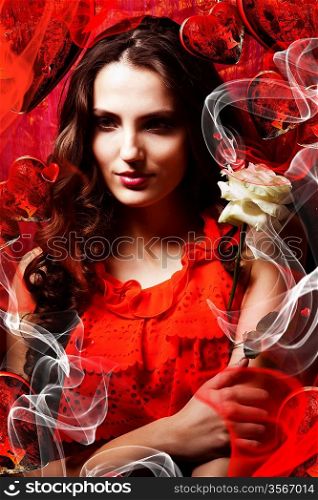 beautiful hot brunette woman in love in red dress around red fabric