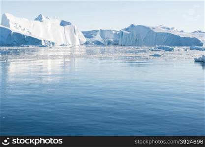 Beautiful Icebergs. Beautiful Icebergs in Disko Bay Greenland around Ilulissat with blue sky