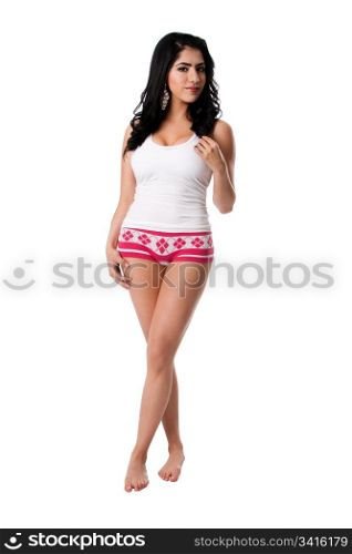 Beautiful in shape healthy happy young woman standing wearing white underwear shirt and pink hotpants, isolated.