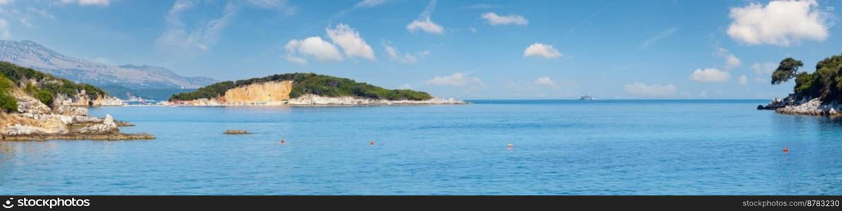 Beautiful Ionian Sea morning summer coast view from beach (Ksamil, Albania). Four shots stitch high-resolution panorama. 