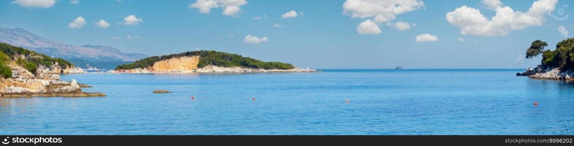 Beautiful Ionian Sea morning summer coast view from beach (Ksamil, Albania). Four shots stitch high-resolution panorama. 