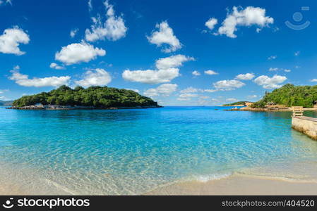 Beautiful Ionian Sea with clear turquoise water and morning summer coast. View from Ksamil beach, Albania.Two shots stitch panorama.