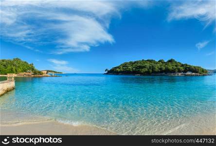 Beautiful Ionian Sea with clear turquoise water and morning summer coast. View from Ksamil beach, Albania.
