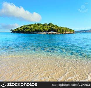 Beautiful Ionian Sea with clear turquoise water and morning summer coast view from beach, Ksamil, Albania.