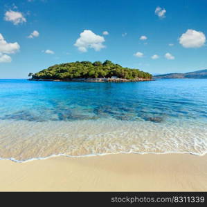 Beautiful Ionian Sea with clear turquoise water and morning summer coast view from beach  Ksamil, Albania .