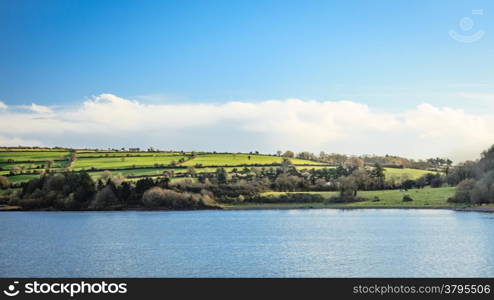 beautiful irish landscape green meadows at calm river Co.Cork, Ireland Europe