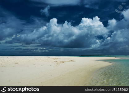 Beautiful island beach with sandspit at Maldives