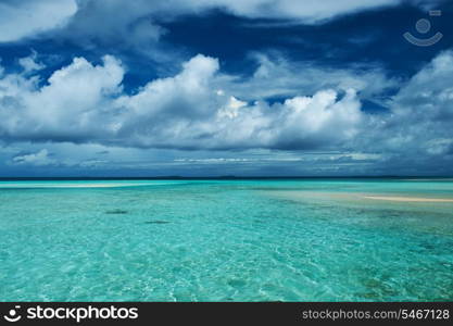 Beautiful island beach with sandspit at Maldives