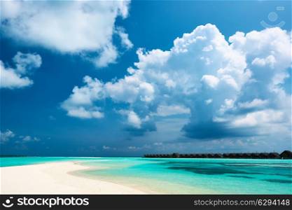 Beautiful island beach with sandspit at Maldives