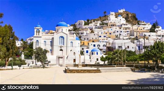 Beautiful islands of Greece - Ios , Cyclades. Whitewashed traditional houses of picturesque village Chora, view of square and church in downtown