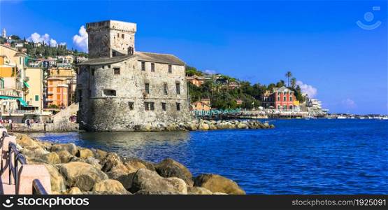 Beautiful italian coastal town Rapallo. View of medieval fortress and beach. Italy, Liguria summer holidays