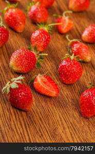 beautiful, juicy, ripe strawberry on a wooden surface. fruit background