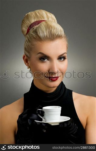 Beautiful lady drinking coffee. Retro portrait