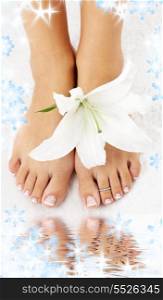 beautiful lady feet with madonna lily in spa