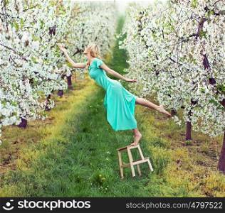 Beautiful lady in the colorful orchard