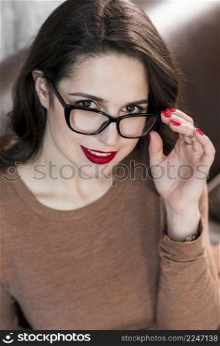 beautiful lady looking black eyeglasses camera