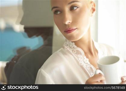 Beautiful lady with cap of coffee or tea