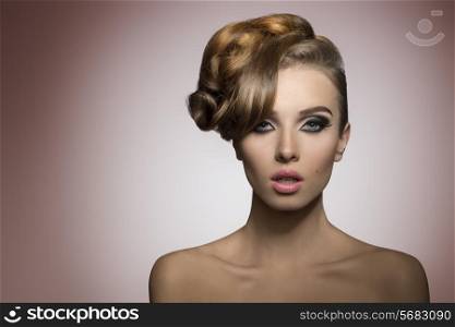 beautiful lady with creative elegant hair-style and fashion make-up in close-up portrait