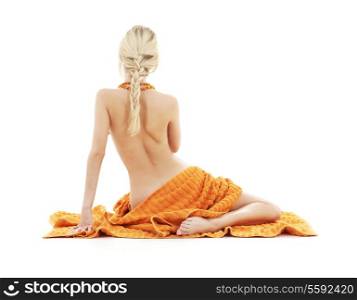 beautiful lady with orange towels over white