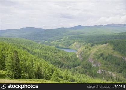 Beautiful lake in Altai mountains and forest Russia