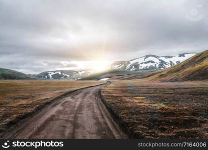 Beautiful Landmanalaugar gravel dust road way on highland of Iceland, Europe. Muddy tough terrain for extreme 4WD 4x4 vehicle. Landmanalaugar landscape is famous for nature trekking and hiking.