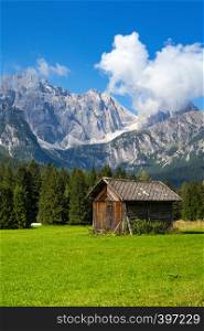 beautiful landscape and small wooden house in the mountains. Dolomites, Italy