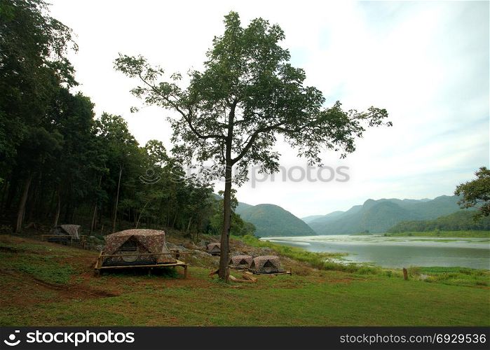 beautiful landscape, camping tents at outdoor camp site near the river