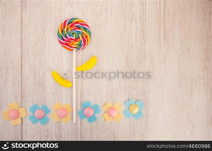 Beautiful landscape formed with a lollipop and candies resembling a flower