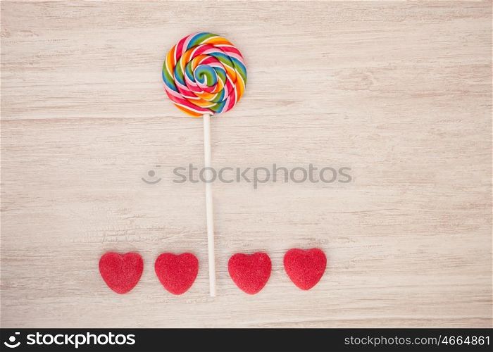 Beautiful landscape formed with a lollipop and heart candies resembling a flower