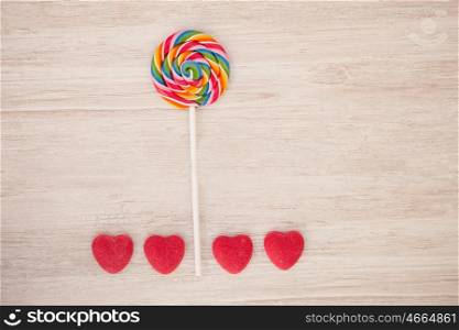 Beautiful landscape formed with a lollipop and heart candies resembling a flower