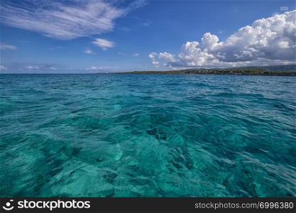 Beautiful landscape from Atlantic ocean to the coastline, turquoise water and blue sky with clouds. Cuba