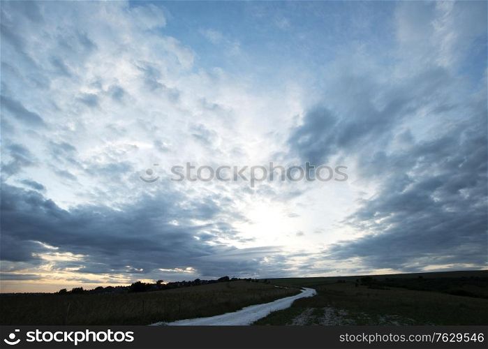 Beautiful landscape image of agricultural English countryside during warm late afternoon Summer light