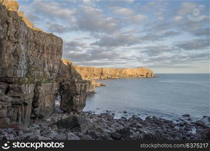 Beautiful landscape image of cliffs around St Govan&rsquo;s Head on Pembrokeshire Coast in Wales