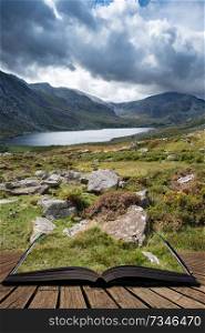 Beautiful landscape image of countryside around Llyn Ogwen in Snowdonia during early Autumn coming out of pages of open story book