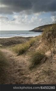 Beautiful landscape image of Freshwater West beach with sand dunes in Pembrokeshire Wales