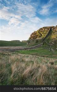 Beautiful landscape image of Hadrian&rsquo;s Wall in Northumberland at. Stunning landscape image of Hadrian&rsquo;s Wall in Northumberland at sunset with fantastic late Spring light