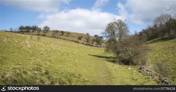 Beautiful landscape image of Peak District on bright sunny Spring day