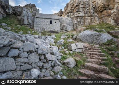 Beautiful landscape image of St Govan&rsquo;s Chapel on Pemnrokeshire Coast in Wales