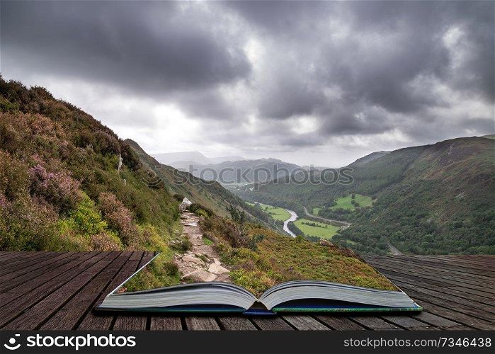Beautiful landscape image of view from Precipice Walk in Snowdonia overlooking Barmouth and Coed-y-Brenin forest coming out of pages in magical story book